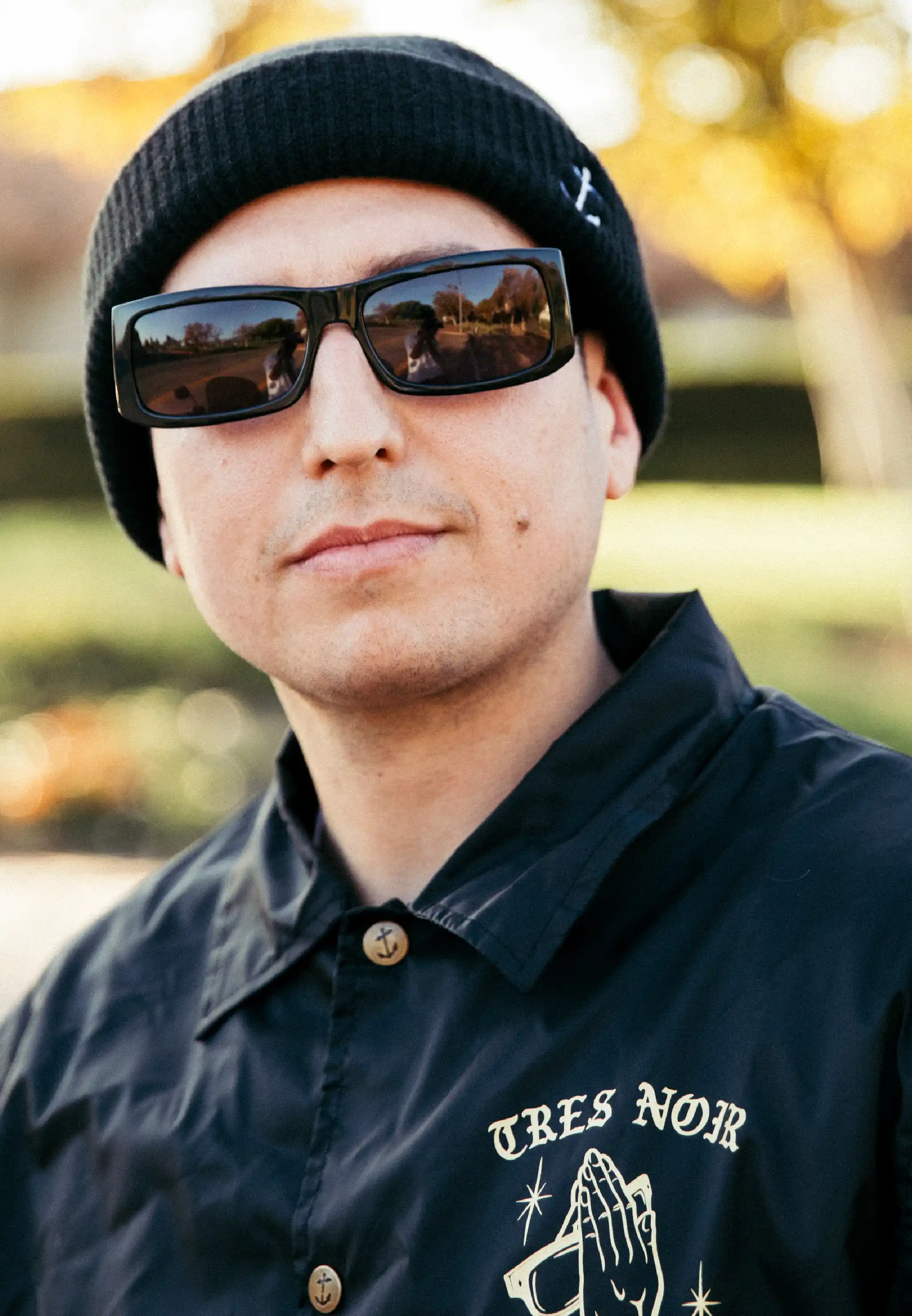 Tortoise Big Iron II sunglasses leaning at an angle on a distressed surface