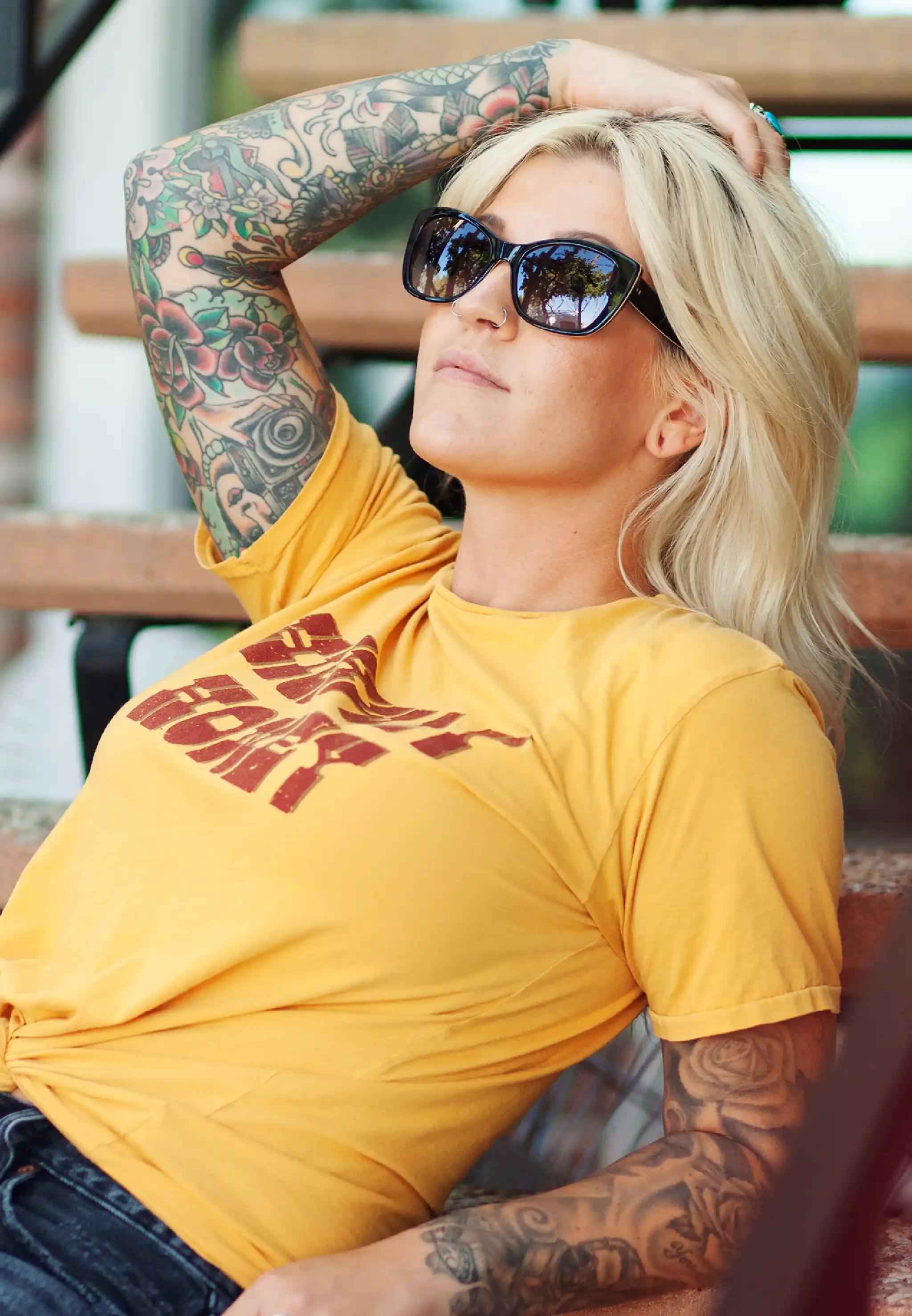 close-up of two Petrillo sunglasses stacked on a hand